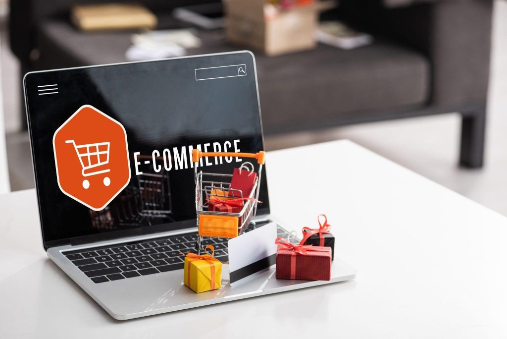 Laptop with e-commerce website and shopping cart, symbolizing online sales growth with SEO and content strategies from a Dallas, Texas SEO Company.